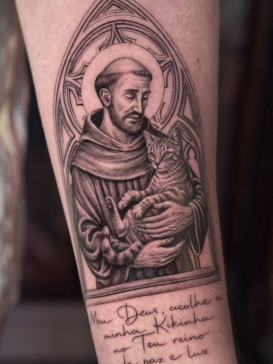 Black-and-grey religious tattoo of Saint Francis holding a cat